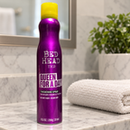 AI-generated lifestyle illustration of one Bed Head TIGI Queen For A Day 10.5 oz can in a home bathroom shelf setting; props not included