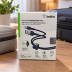 AI-generated lifestyle illustration of the boxed Belkin Pro Flex blue 2 m USB-A to Lightning cable in a travel packing area; background props not included