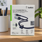 AI-generated lifestyle illustration of the boxed Belkin Pro Flex blue 2 m USB-A to Lightning cable in a home study; background props not included