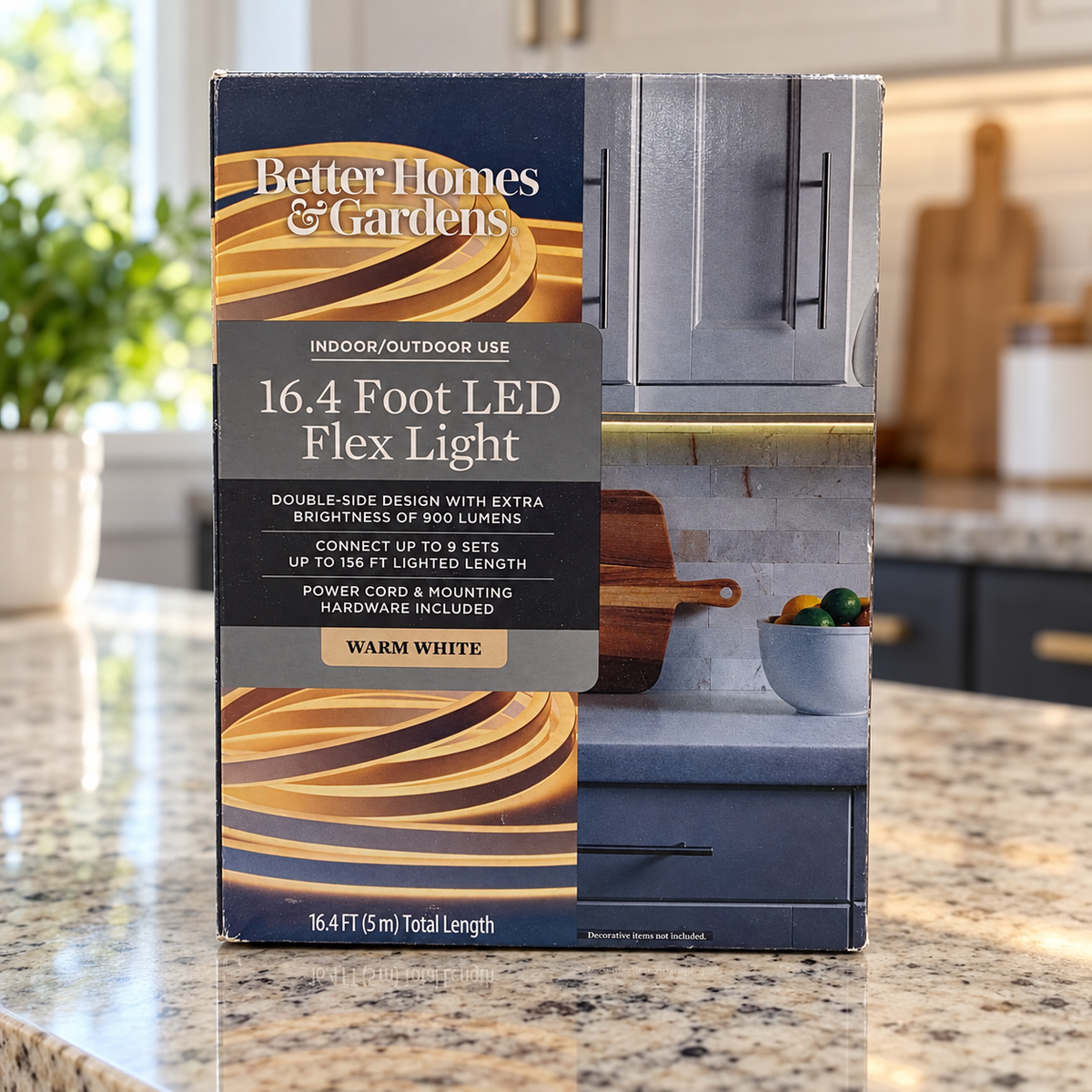 AI-generated scene of the same closed Better Homes & Gardens warm-white 16.4-foot LED flex-light carton on a kitchen counter.