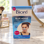AI-generated lifestyle illustration of one matching Bioré Blue Agave 6-nose-strip retail box in a bedroom dressing table; props excluded.
