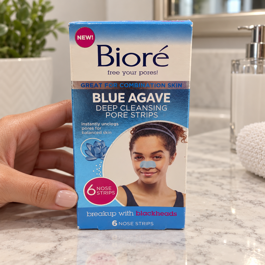 AI-generated lifestyle illustration of one matching Bioré Blue Agave 6-nose-strip retail box in a vanity beside an adult hand; props excluded.