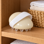 Mary Kay body massager stored on a wooden shelf beside folded washcloths