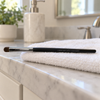 Mary Kay cream eye color and concealer brush drying flat with the bristles clear of the towel.