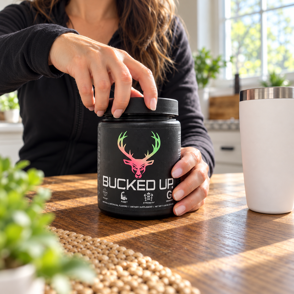 Hands opening the lid of a Bucked Up pre-workout tub. AI-assisted illustration.