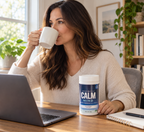 Enjoying a mug of CALM Mind during a break at a home desk.