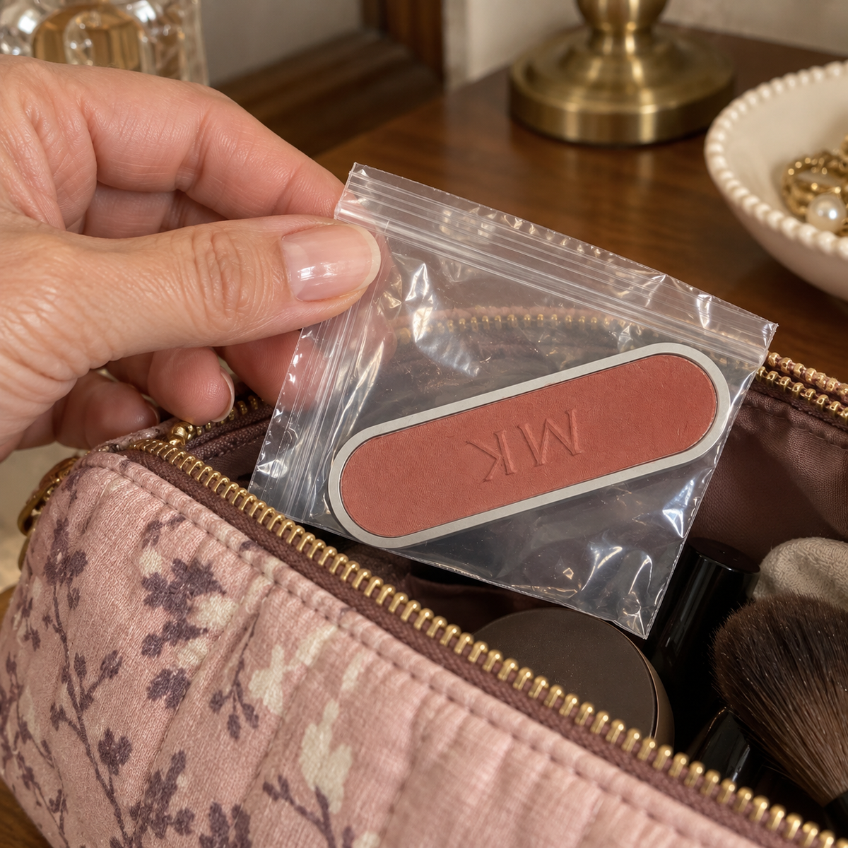 Packing a protected Teaberry blush refill in a makeup pouch