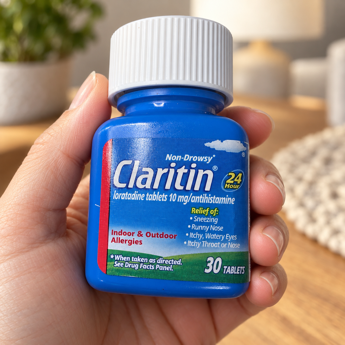 AI-generated scene of an adult holding a closed Claritin30-tablet bottle; props not included.