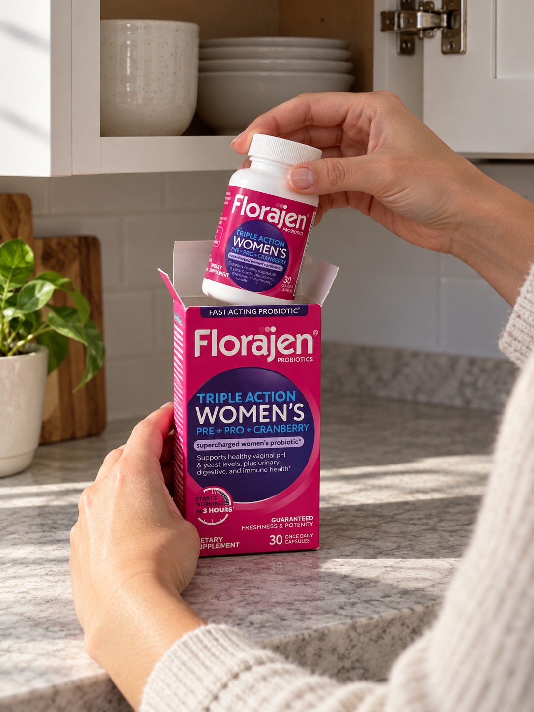 Returning a closed Florajen Women's Triple Action bottle to its carton.