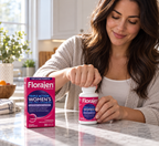 Hands opening a Florajen Women's Triple Action bottle beside its carton.