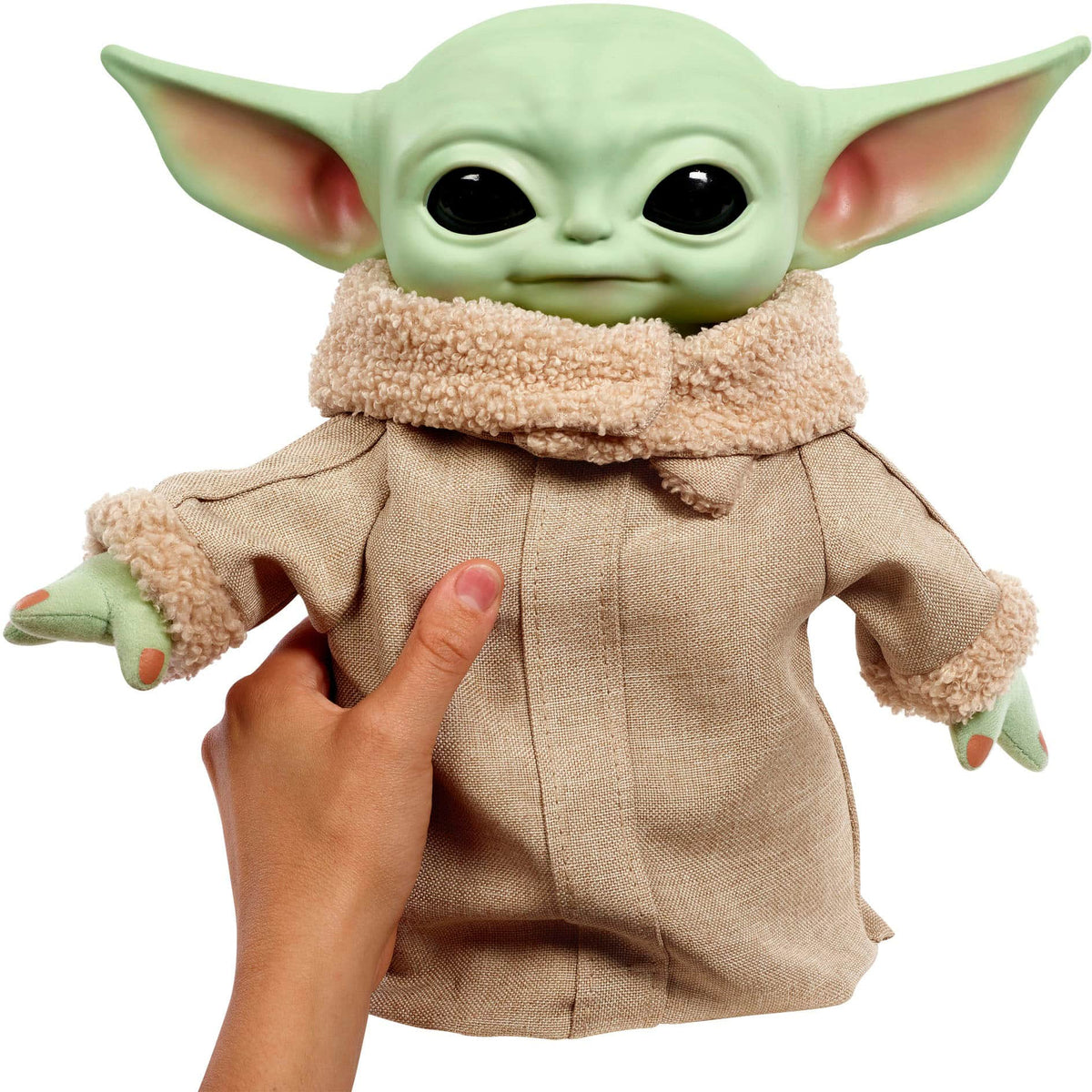 A hand squeezing Squeeze & Blink Grogu's belly with one arm raised.