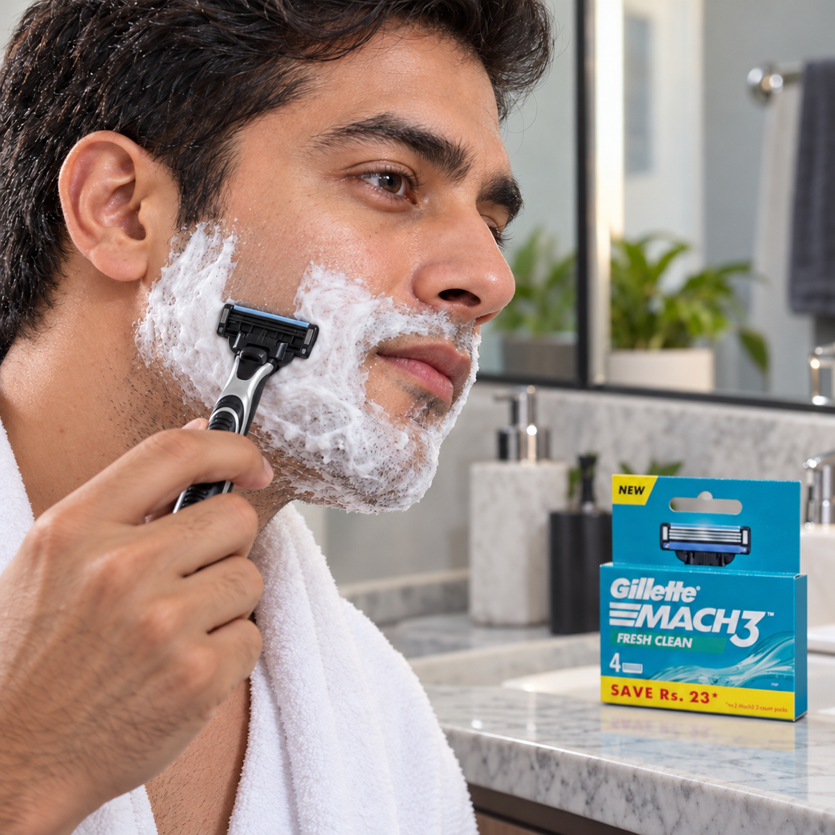 An adult shaving his cheek with a Mach3 razor beside a Fresh Clean refill pack
