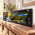 Mongoose Force 1.0 LED wheel scooter in original lime and blue retail packaging, styled entryway setting