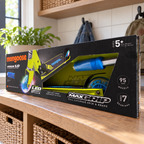 Mongoose Force 1.0 LED wheel scooter in original lime and blue retail packaging, styled mudroom setting
