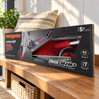 Mongoose Force 1.0 red and silver scooter in original retail packaging, styled entryway setting