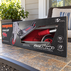Mongoose Force 1.0 red and silver scooter in original retail packaging, styled porch setting