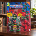 Mattel MOTU Origins Leech in original blister packaging, styled bookshelf setting
