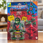 Mattel MOTU Origins Leech in original blister packaging, styled living room setting