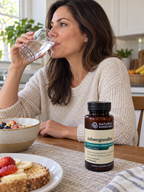 A supplement routine with Nature's Sunshine Ashwagandha and a glass of water.