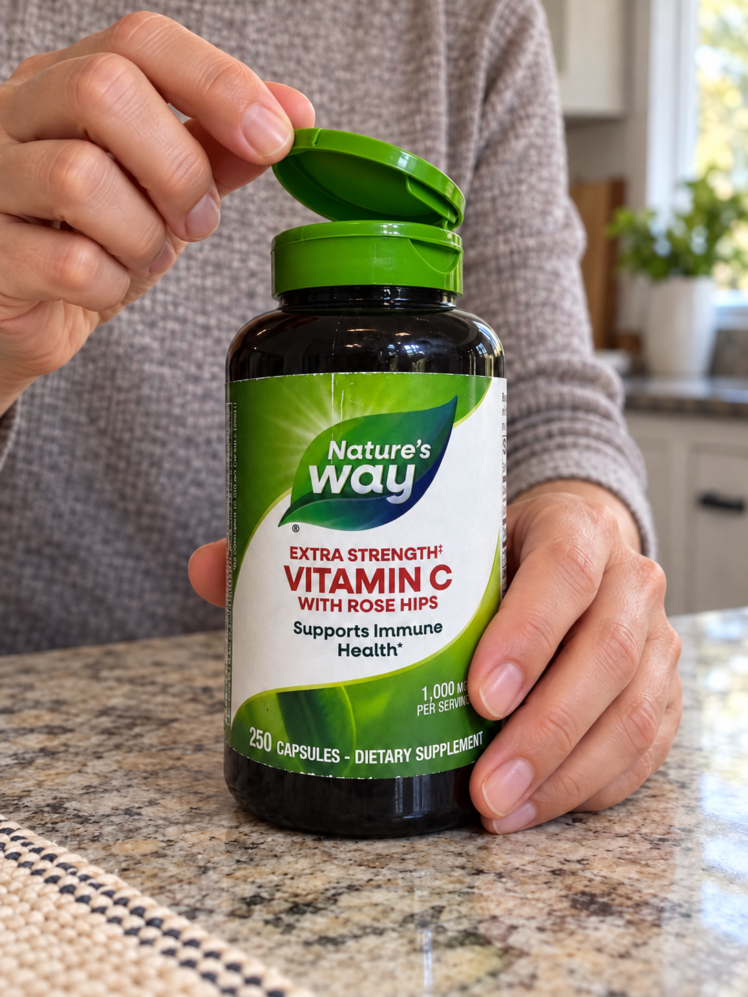 Opening the green flip-top cap on Nature's Way Vitamin C with Rose Hips.