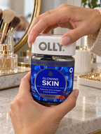 Hands opening an OLLY Glowing Skin Plump Berry gummy jar.