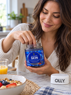 Reaching into an OLLY Glowing Skin gummy jar at breakfast.