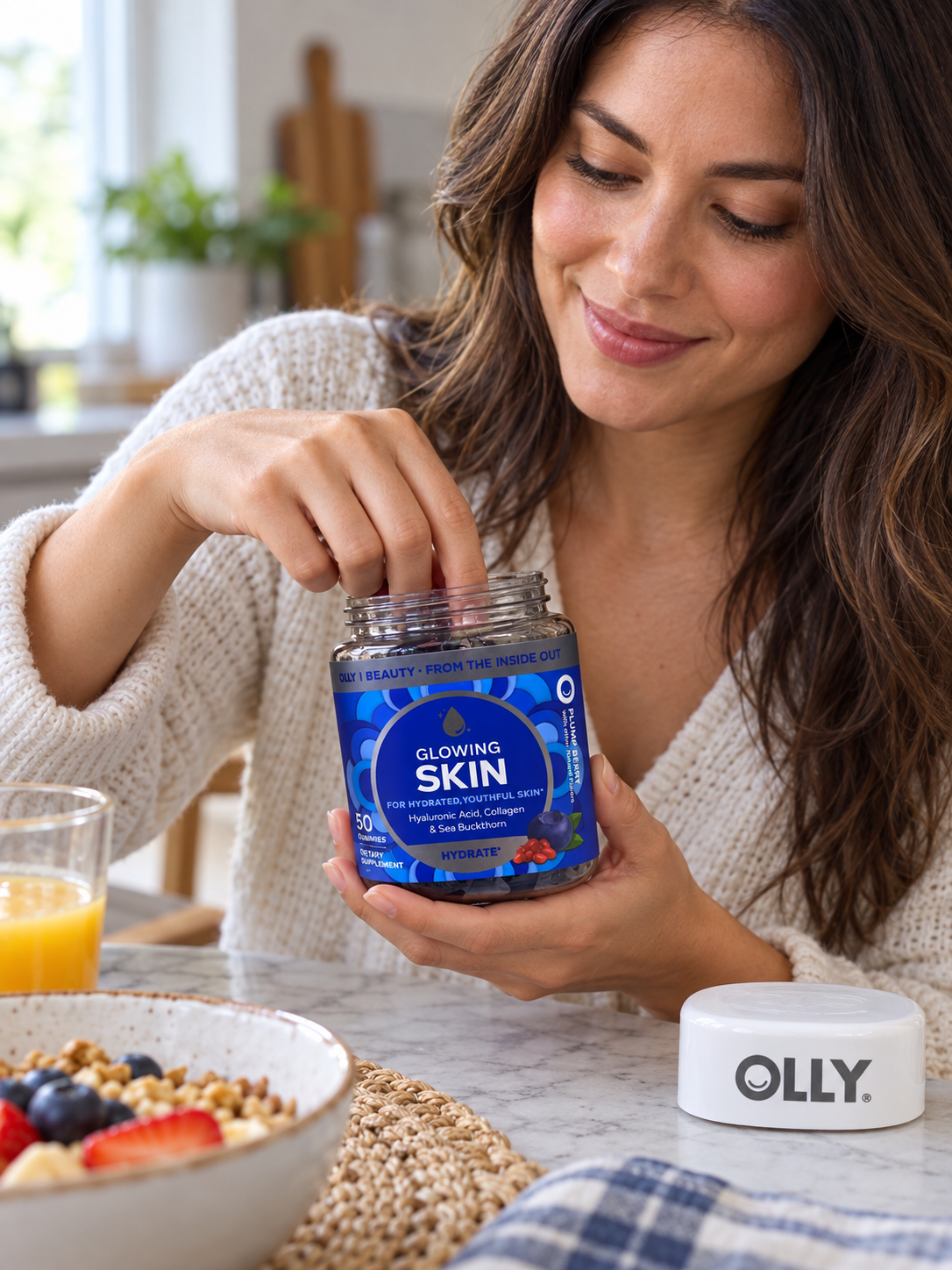 Reaching into an OLLY Glowing Skin gummy jar at breakfast.