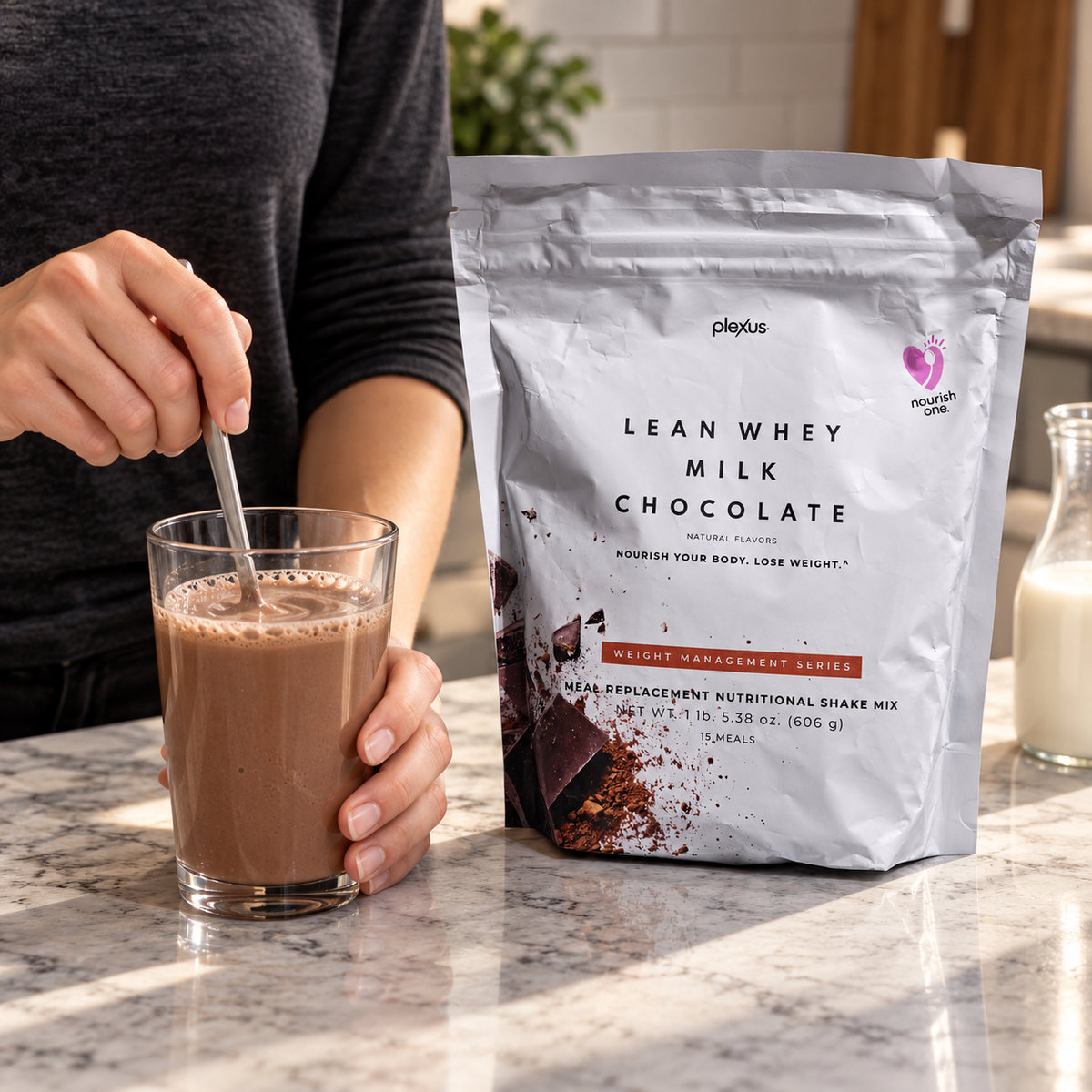 Stirring a Plexus Lean Whey Milk Chocolate shake in a glass