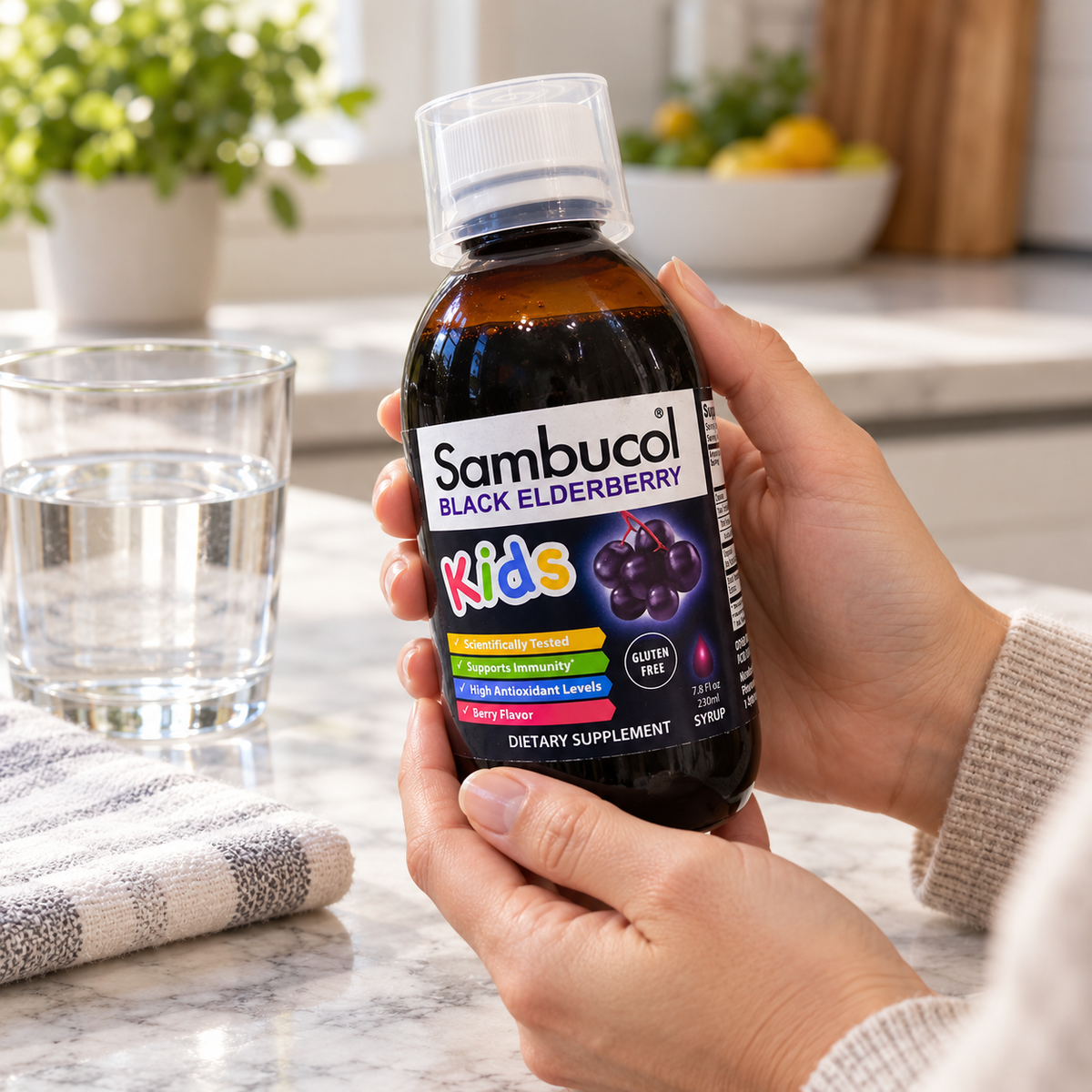 Adult checking a Sambucol Kids 7.8 fl oz bottle