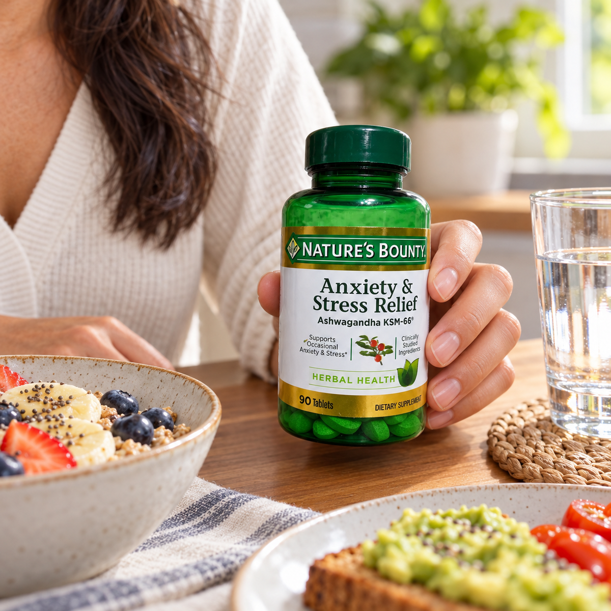 Holding Nature’s Bounty Ashwagandha KSM-66 beside breakfast
