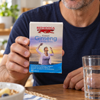 Red Kooga Ginseng and Ginkgo carton held beside breakfast