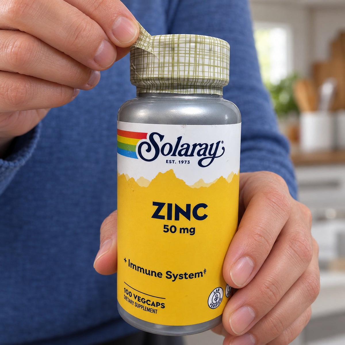 Removing the outer seal from a Solaray Zinc 50 mg bottle