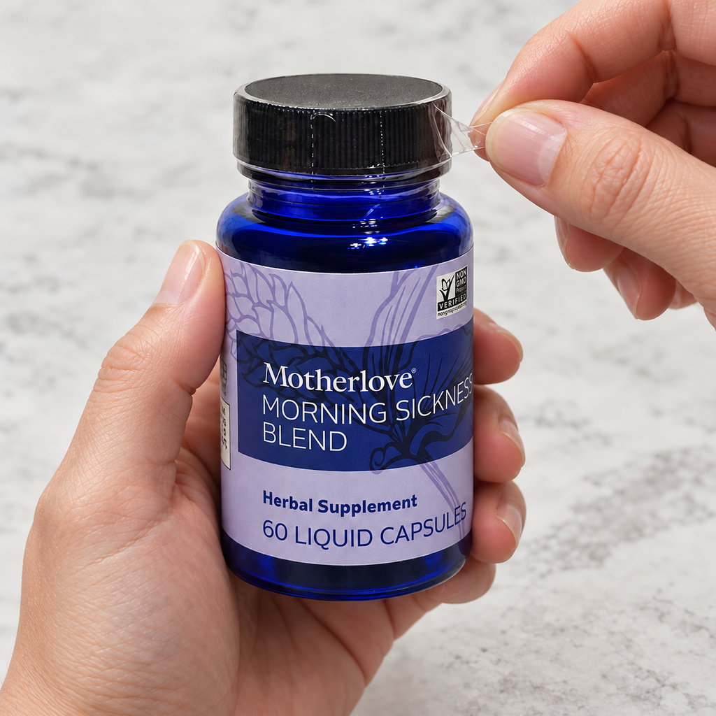 AI-generated illustration of adult hands peeling the clear cap band on a closed blue Motherlove Morning Sickness Blend 60-liquid-capsule bottle.