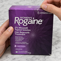 Opening the Women’s Rogaine three-month solution carton