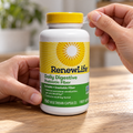 AI-generated preparation illustration of adult hands peeling the clear outer cap band from a Renew Life Daily Digestive Prebiotic Fiber 150-capsule bottle. Yellow cap remains closed.