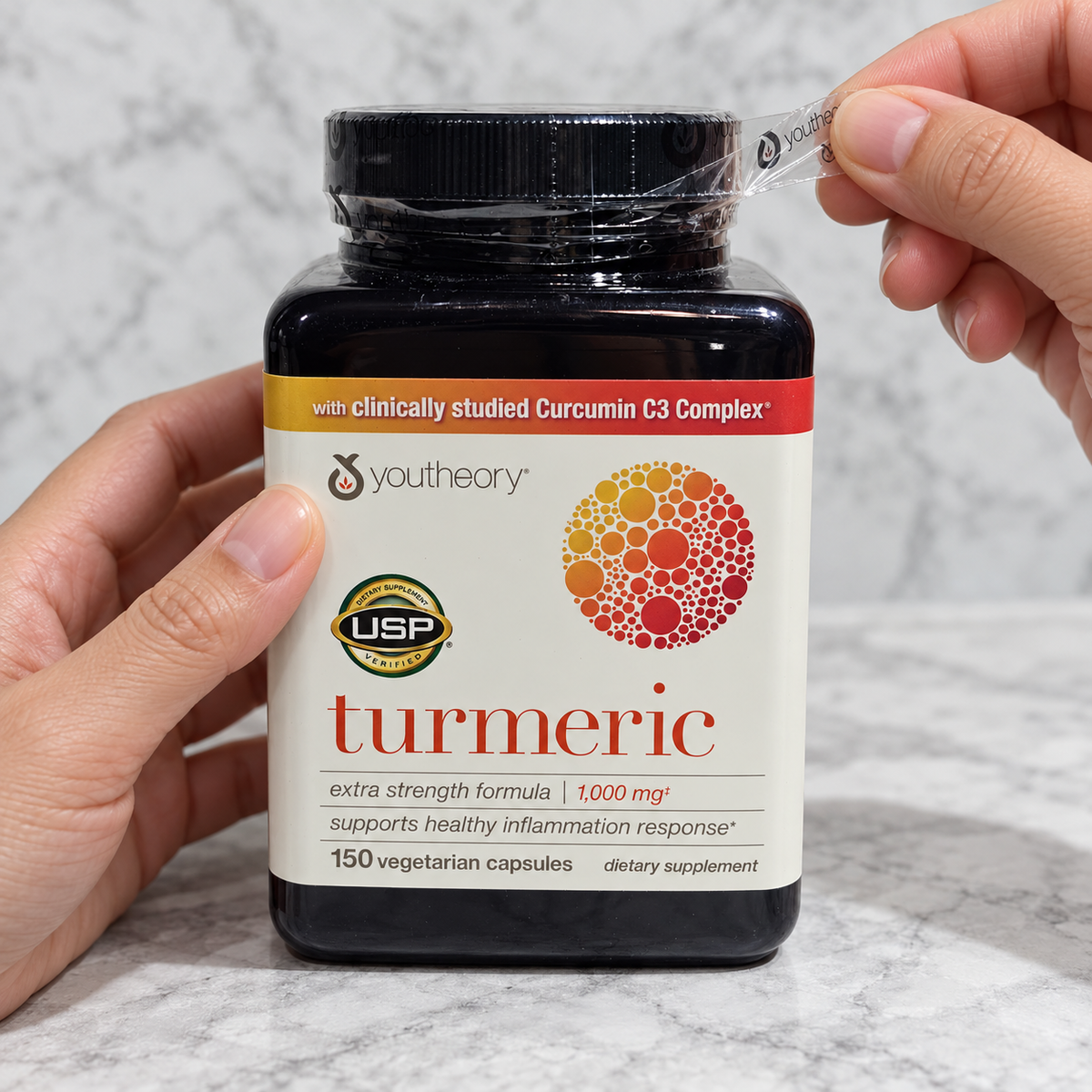 AI-generated preparation illustration of adult hands peeling the printed clear outer band from a Youtheory Turmeric Extra Strength 150-capsule bottle. Black cap remains closed.