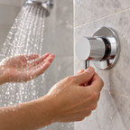 AI-generated context: adjusting shower-water volume with Serin chrome trim; shower fixtures not included