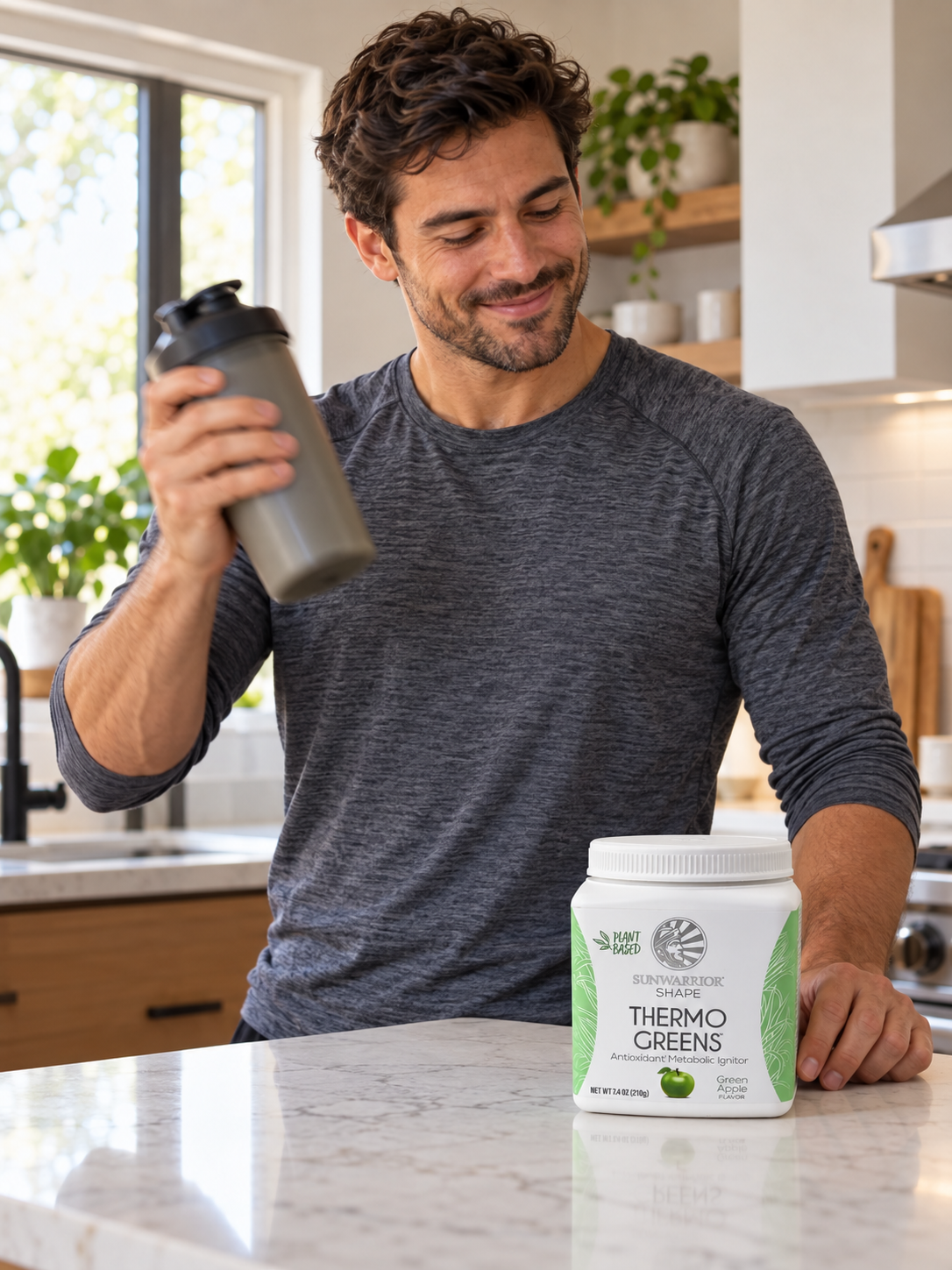 Shaking a drink with Sunwarrior Thermo Greens Green Apple nearby.