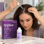Applying Women’s Rogaine solution to the parted scalp with a dropper