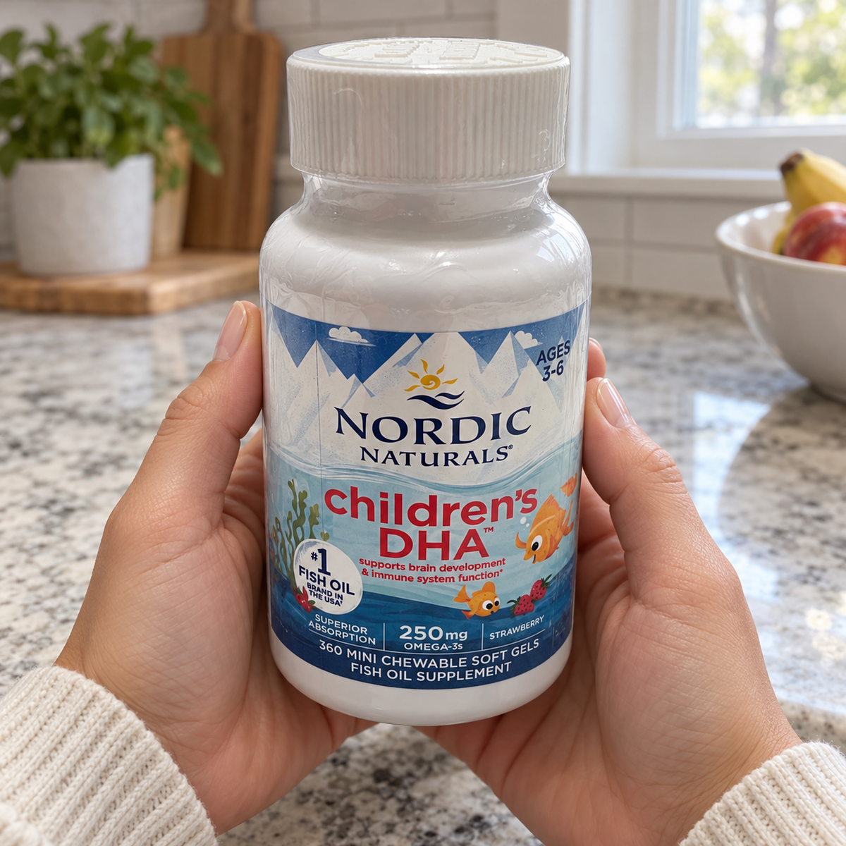 Adult holding a sealed Nordic Naturals Children's DHA strawberry 360-soft-gel bottle