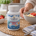 Nordic Naturals Children's DHA strawberry bottle beside a breakfast setting