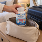 Adult packing a closed Nordic Naturals Children's DHA bottle in a travel bag