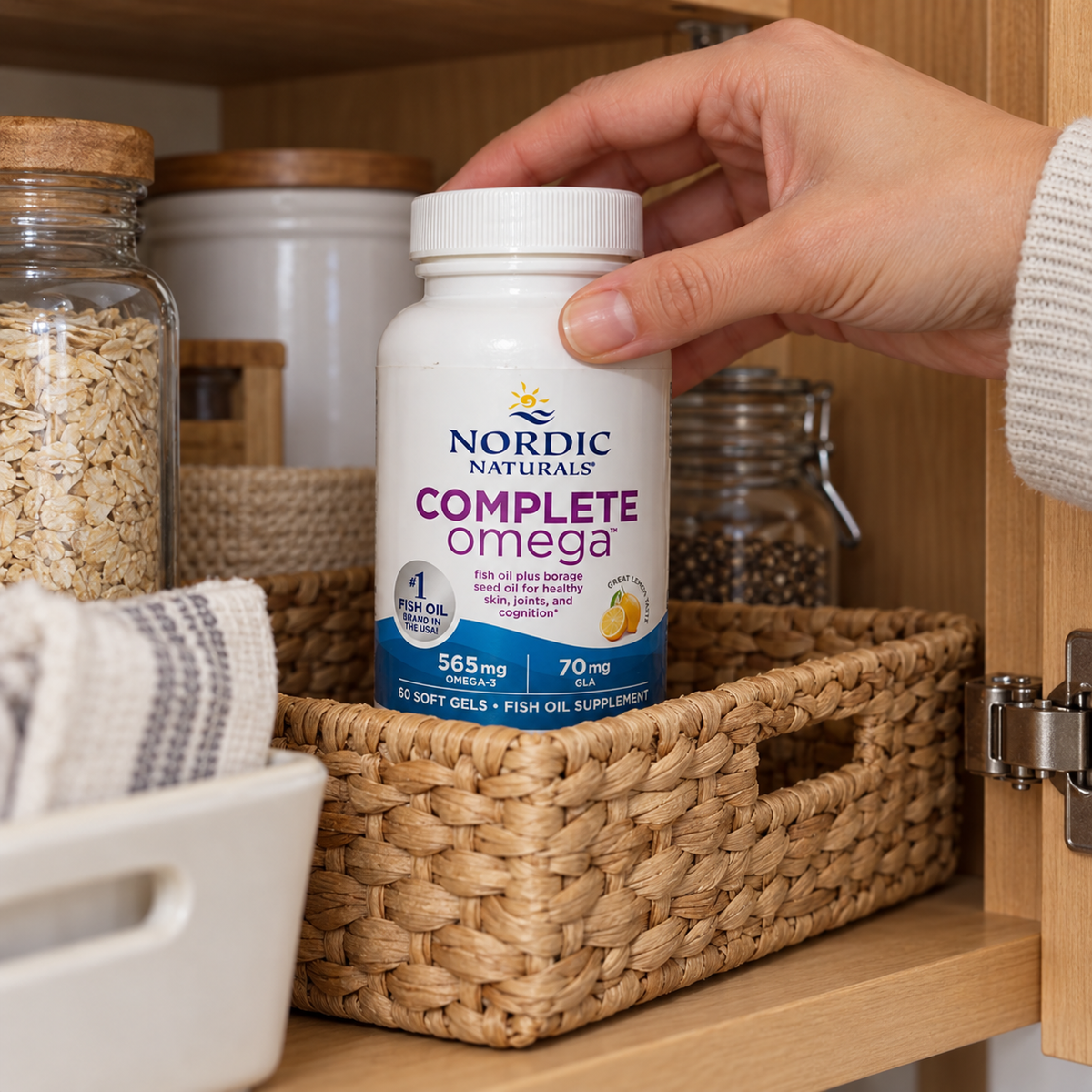 Nordic Naturals Complete Omega bottle being placed in a pantry organizer