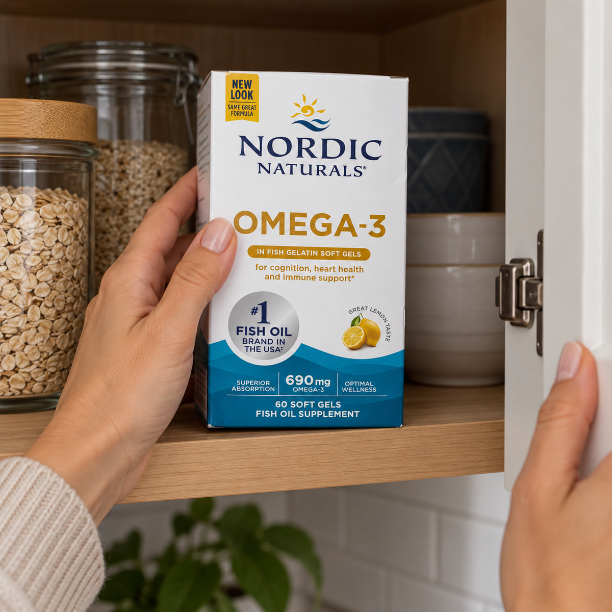Reaching for a Nordic Naturals Omega-3 carton in an upper cupboard