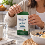 Opening a Nordic Naturals Mood Support carton at the breakfast table
