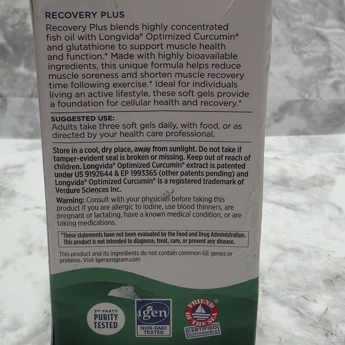 Original photograph of actual Nordic Naturals Recovery Plus box directions, warning label and carton wear
