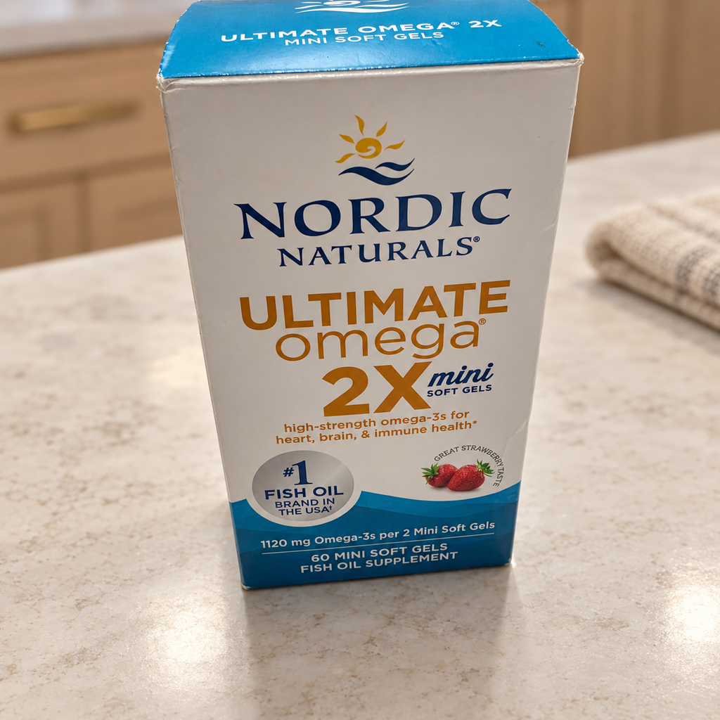 AI-styled illustrative counter scene with Nordic Naturals Ultimate Omega 2X Mini Strawberry box; props not included