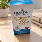 AI-styled illustrative organized scene with Nordic Naturals Ultimate Omega 2X Mini Strawberry box; props not included