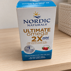 AI-styled illustrative shelf scene with Nordic Naturals Ultimate Omega 2X Mini Strawberry box; props not included