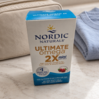 AI-styled illustrative travel scene with Nordic Naturals Ultimate Omega 2X Mini Strawberry box; props not included